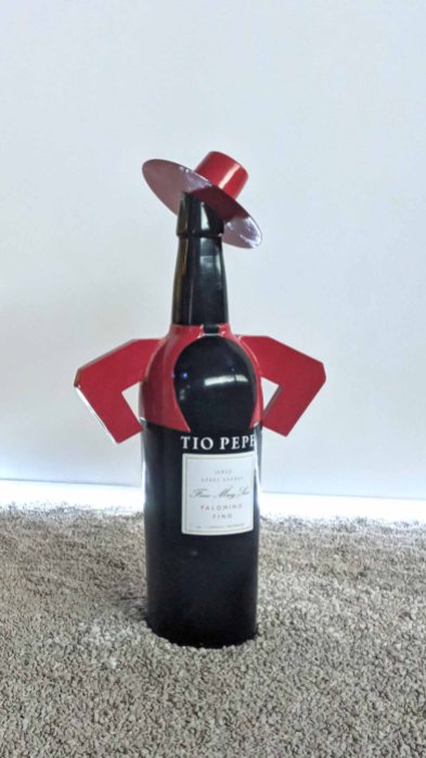 A bottle of Tio Pepe Fino, a style of Sherry that is aged entirely under flor (layer of yeast), and therefore not oxidized. Finos are dry, golden in color, and best served cold.
